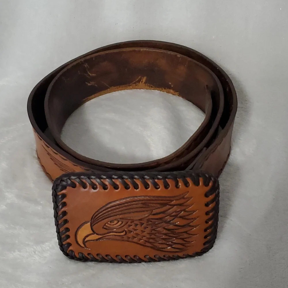 Vintage Leather Belt With Eagle Buckle and Details Embossed Along the Strap.